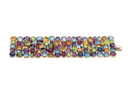 "Allegra" bracelet in gold with coloured gemstones, 2003. Designed as wide articulated band set with variously shaped and cut gemstones including: amethysts, citrines, peridots, tourmalines and blue topazes.